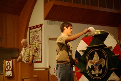 Mark lit the candles on the Scout Law medallion